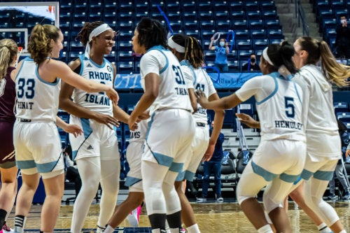 Women’s basketball team huddles on the court