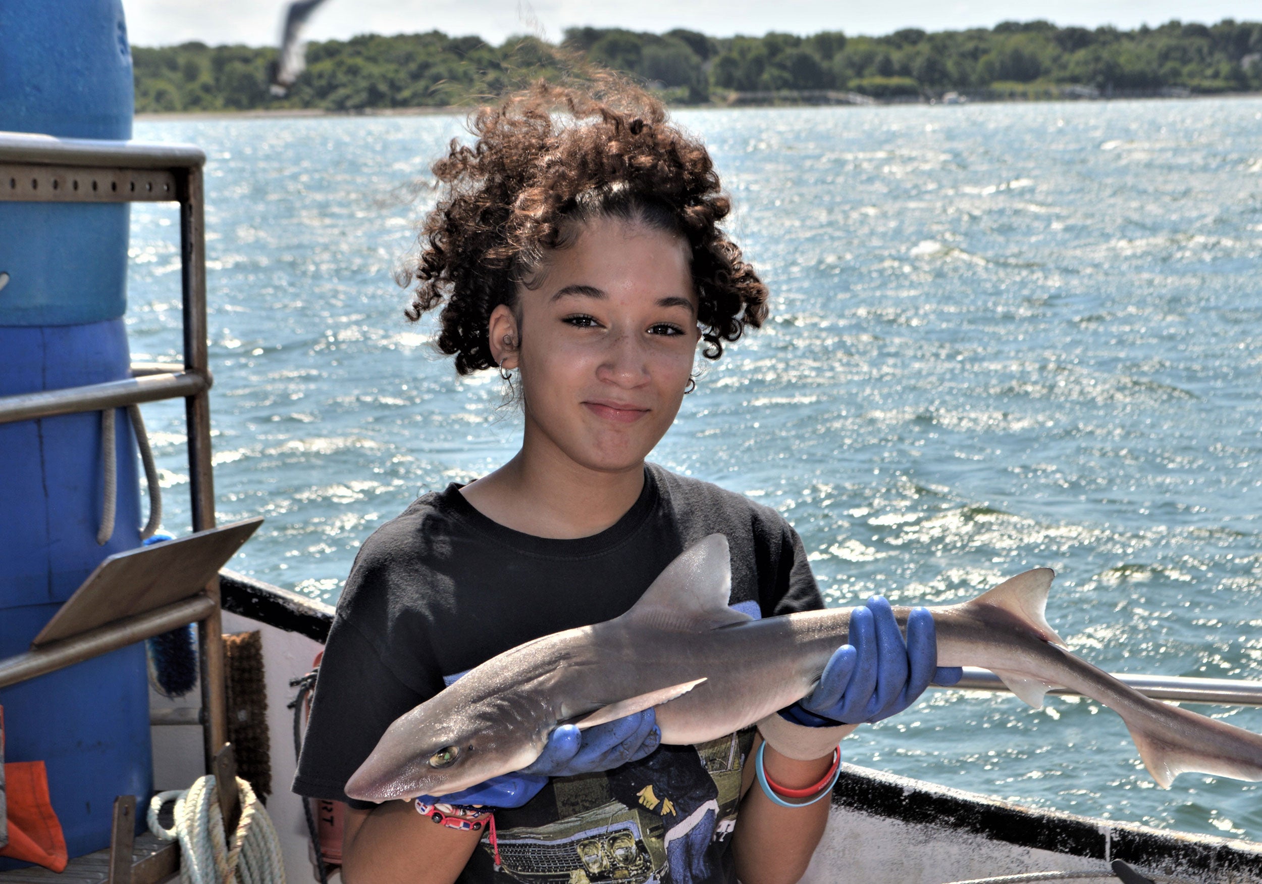 Shark camp student holding a dogfish