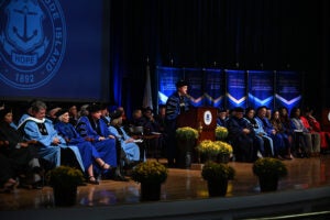 President Parlange on stage surrounded by university leadership and others