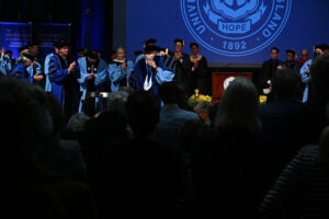 President Parlange on stage after receiving the URI Presidential Medallion from Chair of the Board of Trustees Margo Cook