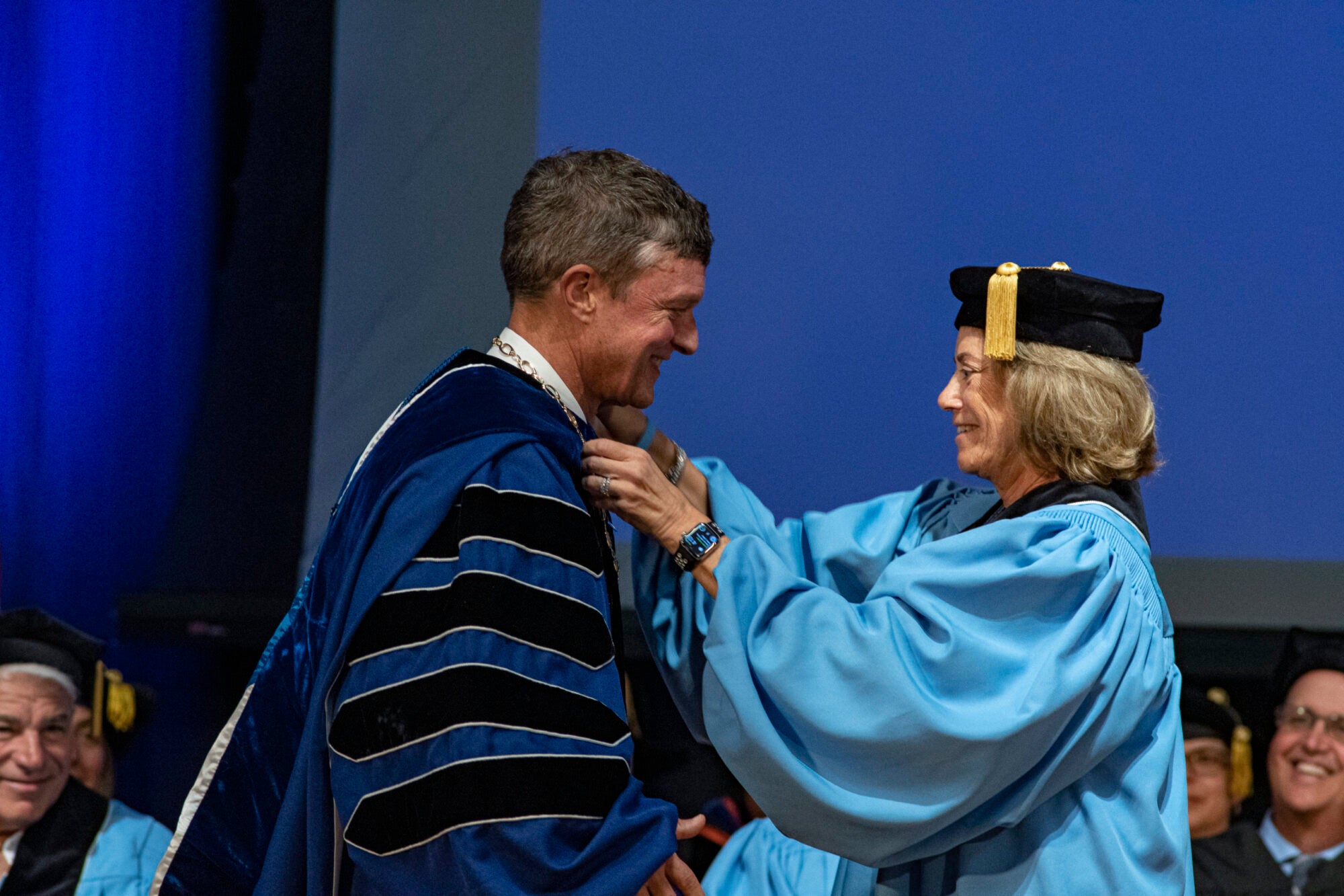 President Parlange receives the URI Presidential Medallion from Chair of the Board of Trustees Margo Cook