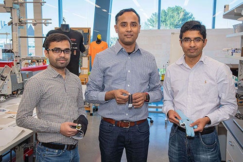 professors Dhaval Solanki, Krishna Venkatasubramanian, Kunal Mankodiya in URI’s Wearable Biosensing Lap