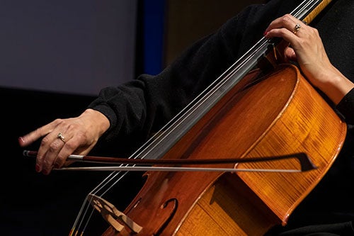 person playing the cello