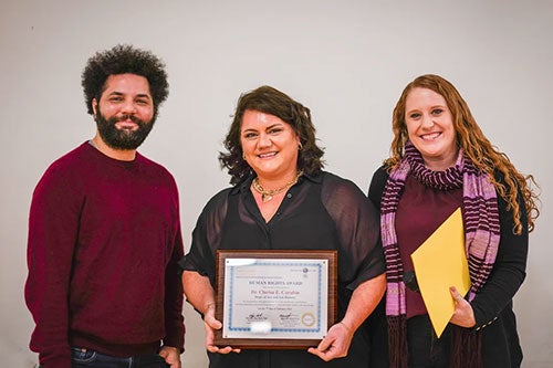 Brendan Skip Mark, professor Clarisa Carubin (center) peace award recipient and Meg Frost