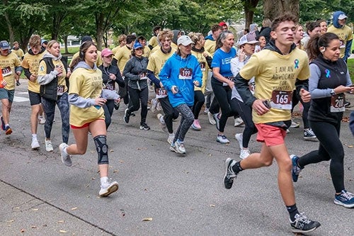 Runners participating in the URI Be5K annual race
