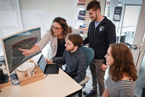 Students and faculty member working on URI STEM for Elections Network