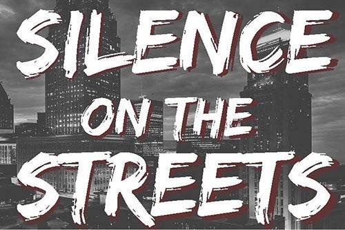 City image of skyscrapers in black and white overlaid with the words Silence on the Streets