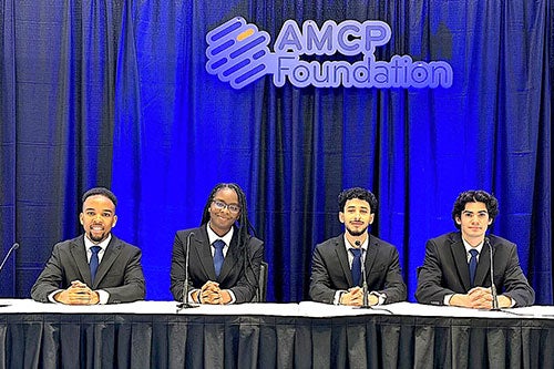 URI doctor of pharmacy students Willy Njeru, Vanessa Oseghale, Matthew Pari, and Ramez Rizk at the AMCP national therapeutics skills competition where they finished first