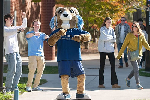 Rhody and students dancing